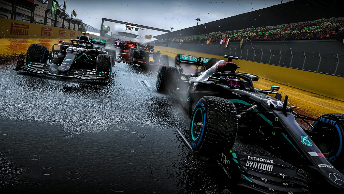 Formula One cars at starting line during rain