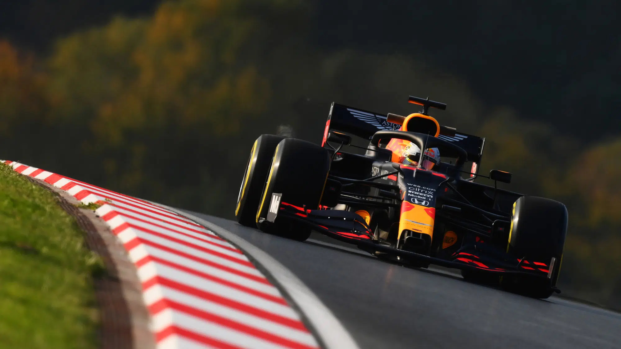 Red Bull Car cresting hill on track
