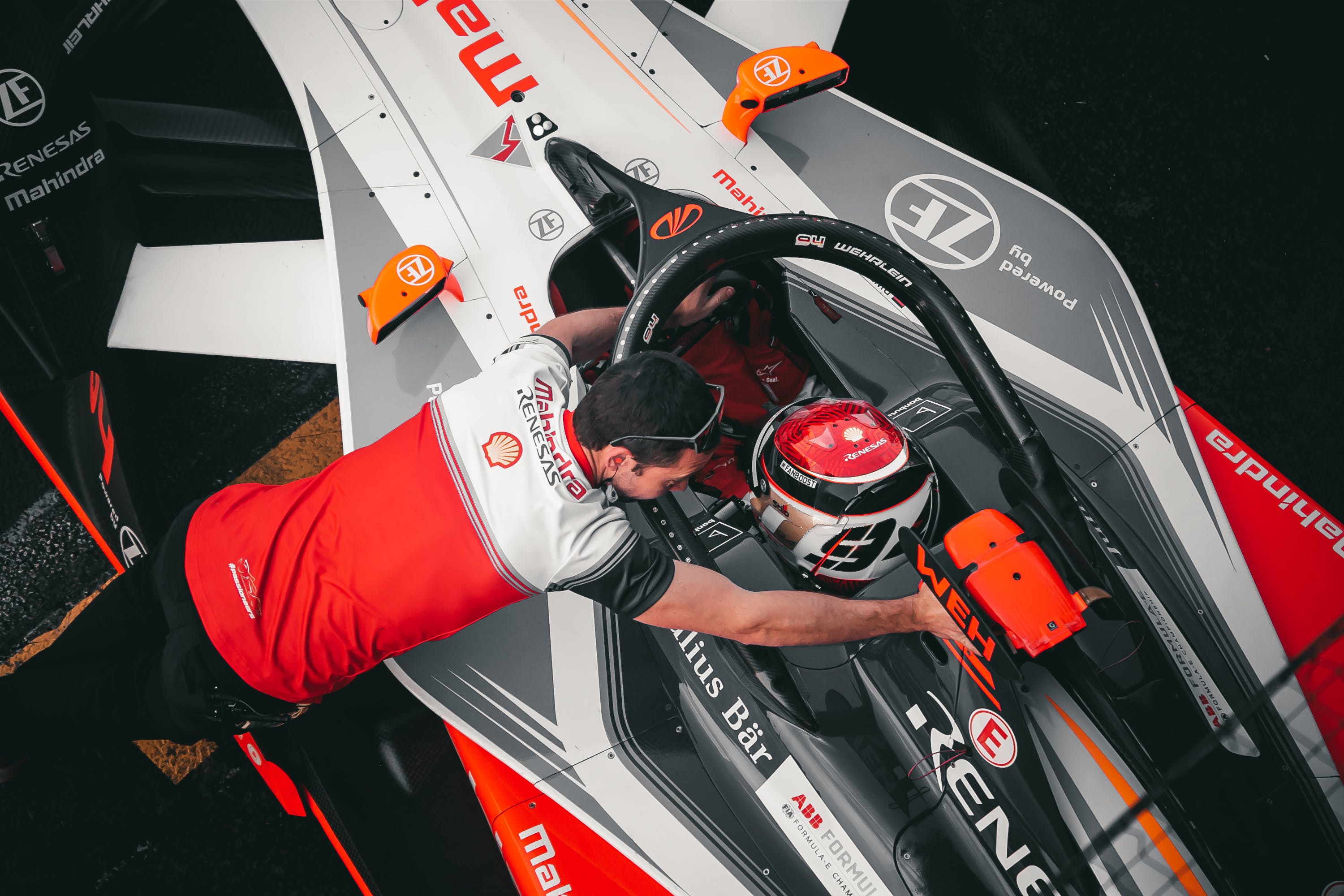 Formula One driver talking to teammate in car