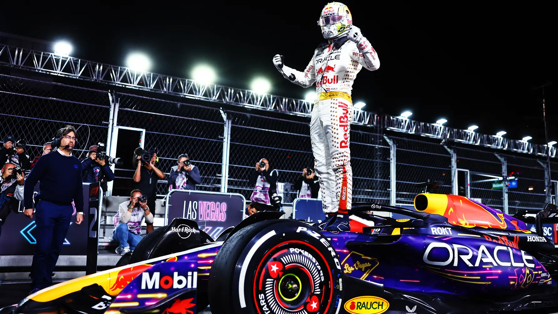 Formula One Vegas GP champion standing on RedBull car